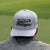 Gray golf hat with "Legalize Mulligans" embroidered in white text, ideal for avid golfers.