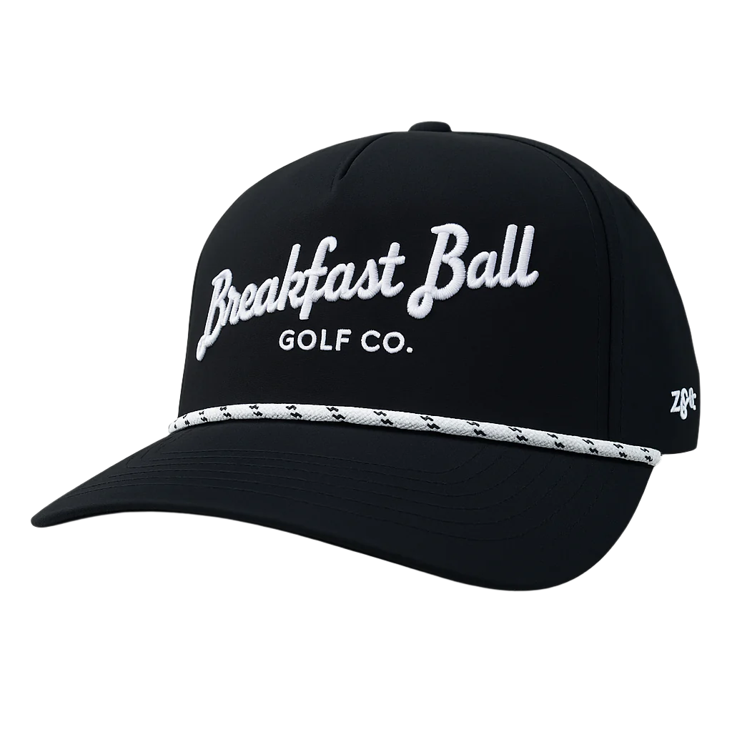 Black cap with 'Breakfast Ball Golf Co.' text on a white background