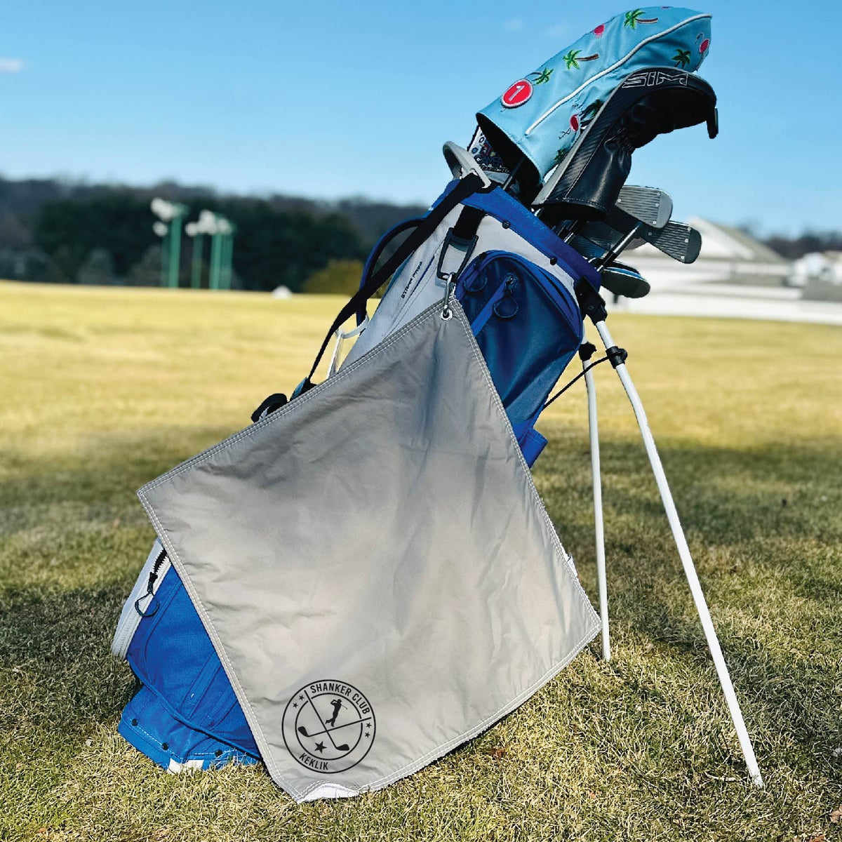 Custom all-weather golf towel attached to a golf bag