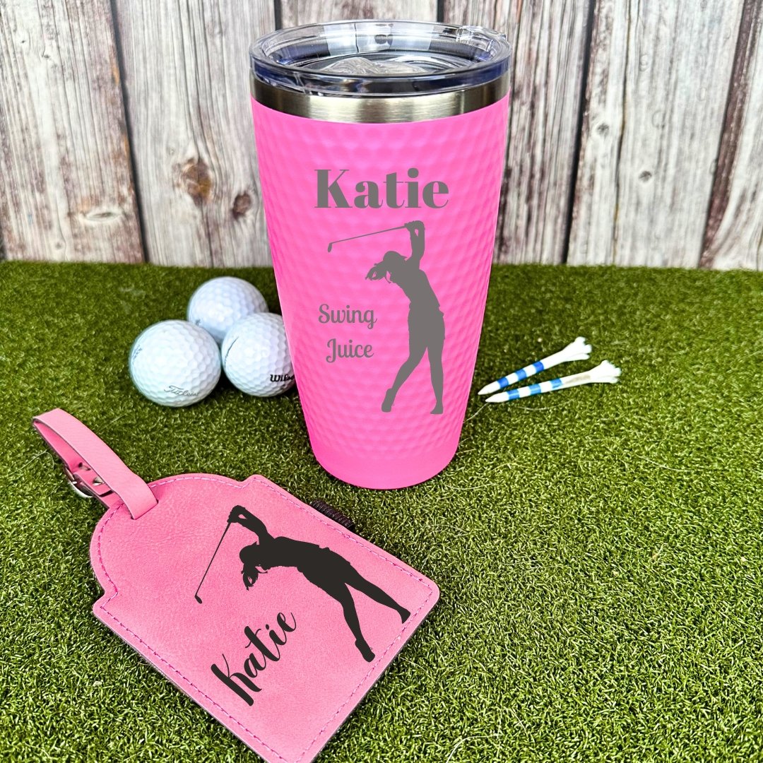 Personalized golf gift set with a bag tag and tumbler in pink tones